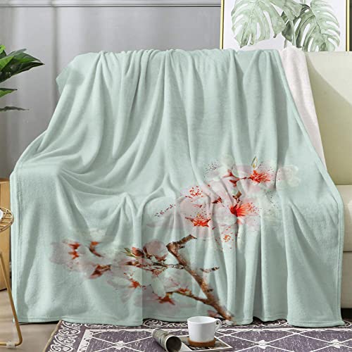 Couverture Polaire Fleurs de Cerisier pour Vos Soirées Cocooning sur le Canapé
