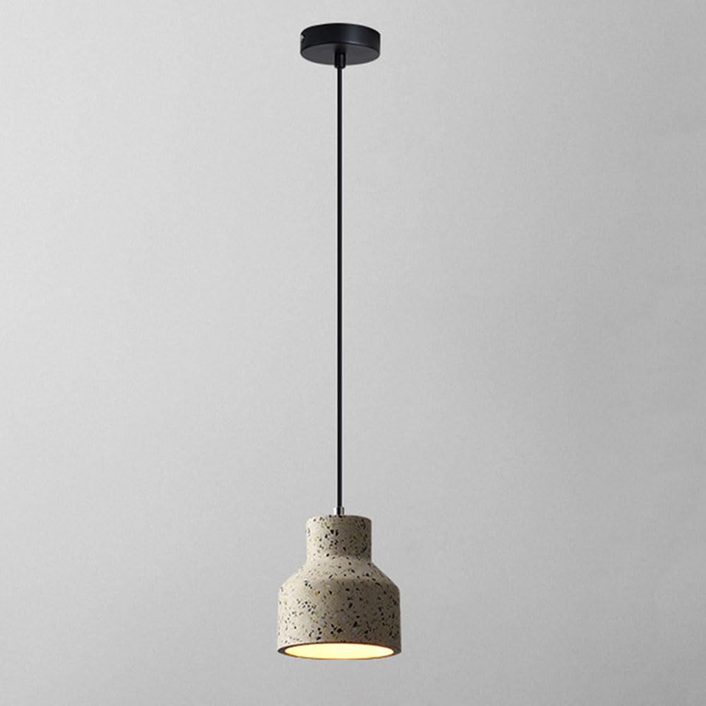 Lustre en ciment pour eclairer efficacement les tables et plans de travail