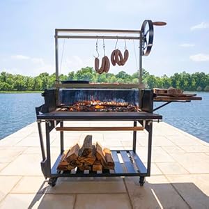 Backyard Discovery Argentine Santa Maria Heritage Wood Fire & Charcoal BBQ Grill with Adjustable Grill Grates, Fire Bricks, Heavy-Duty Steel, S-Hooks, Acacia Wood Table for Outdoor Gaucho Grilling Backyard Discovery Argentine Santa Maria Heritage Wood Fire Charcoal BBQ Grill with Adjustable Grill Grates Fire Bricks Heavy Duty Steel S Hooks Acacia Wood Table for Outdoor Gaucho Grilling