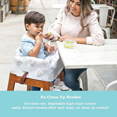 Image of J.L. Childress Disney Baby Disposable High Chair Covers, 12 Pack - Pooh | Individually wrapped, disposable & recyclable restaurant high chair covers make traveling with babies, toddlers & kids easier