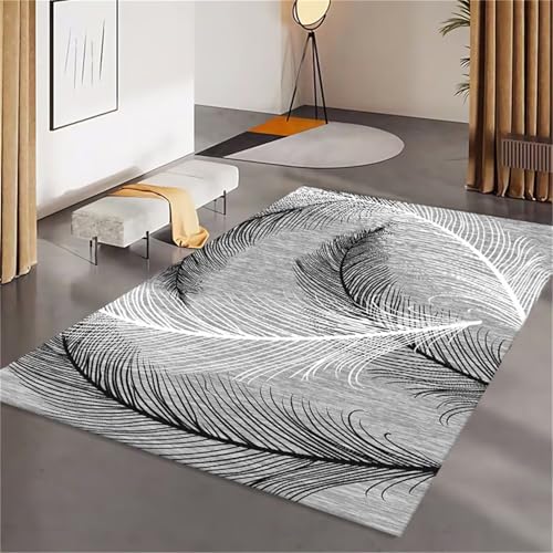 Tapis doux gris 180x270cm avec envers antidérapant et graphisme plumes