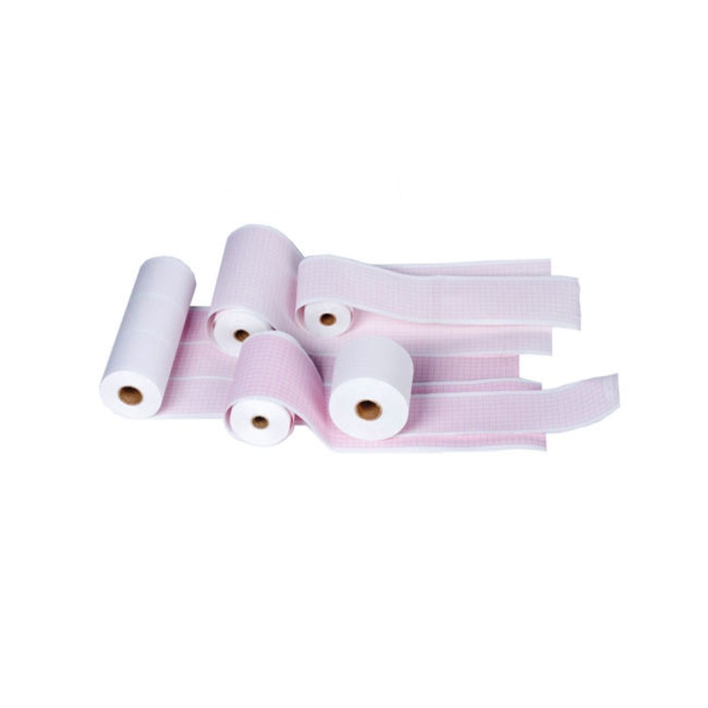 Multiple rolls of ECG chart paper, some unrolled, showing various sizes and grid patterns, including pink and white rolls.