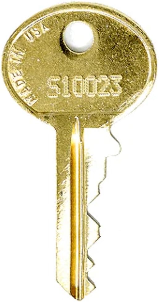 A brass-colored replacement key with 'S10023' stamped on its head, indicating a specific key code.
