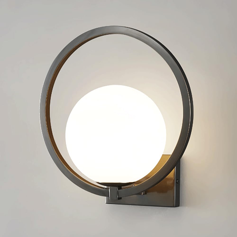 Lámpara de pared con anillo negro y difusión de luz suave para lectura en el dormitorio