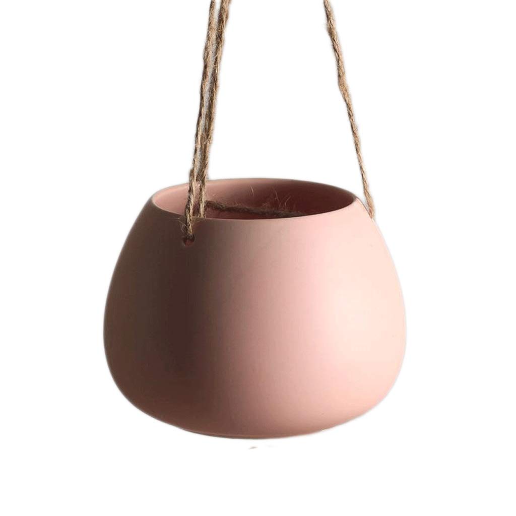 Cesta colgante de pared rosa sin agujero que evita manchas de agua en casa