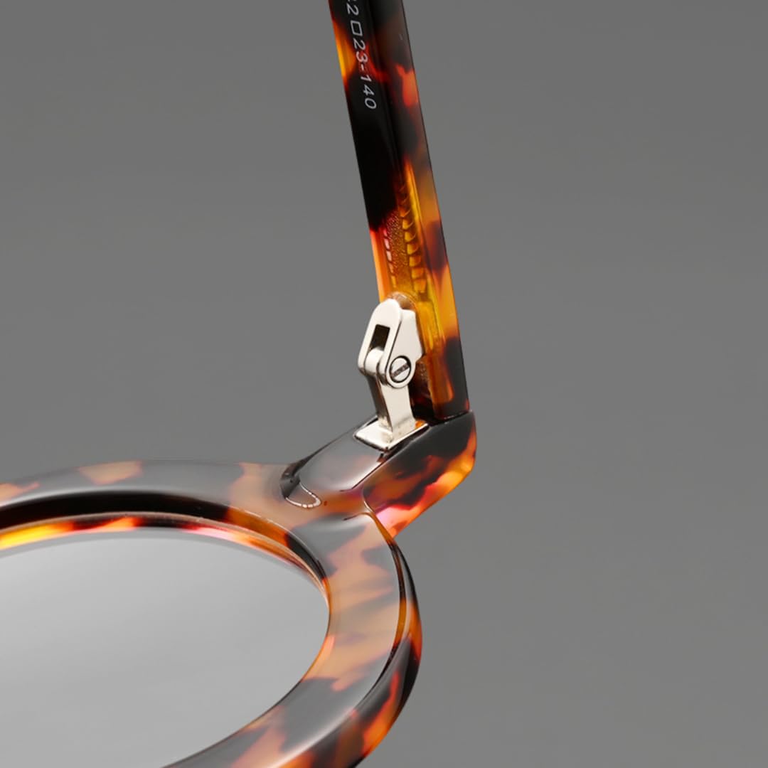 Occhiali da sole rotondi in acetato, montatura alla moda vintage.