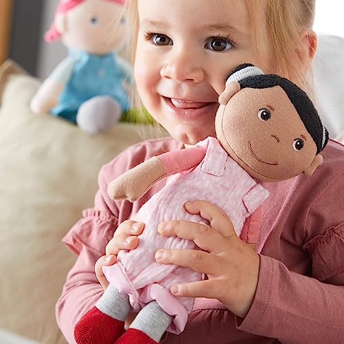 Image of HABA Snug Up Doll Rumbi - 10 inch Soft Doll with Black Hair and Pink Overalls - Machine Washable for 18 Months and Up