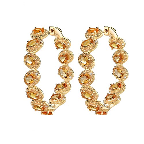 Boucles d'oreilles clous en argent sterling et topaze bleue ovale élégante