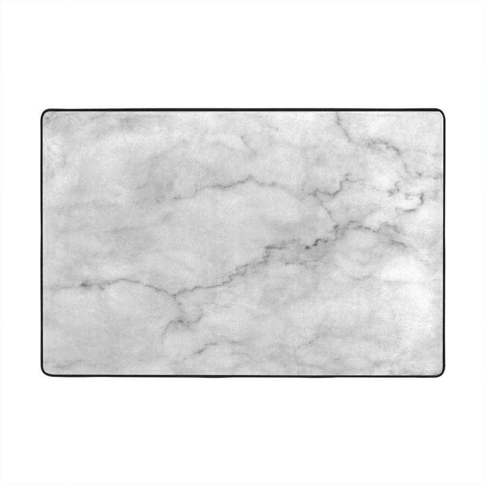 Grand tapis de sol marbre blanc idéal pour réchauffer l'ambiance du salon