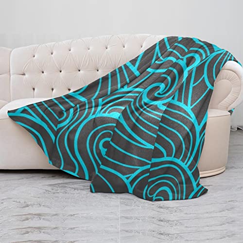 Couverture douce motif vagues pour cocooning sur canapé et voyage