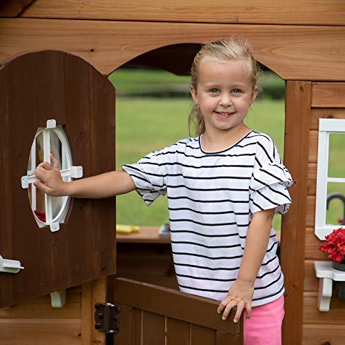 Image of Backyard Discovery Aspen Cedar Wooden Kids Playhouse Cottage with Play Kitchen, Snack Bar, Picnic Bench, Dinner Bell, Mailbox, Dutch Door, Flowerpot Holders, Toy Lights, Country Style for Outdoor Play