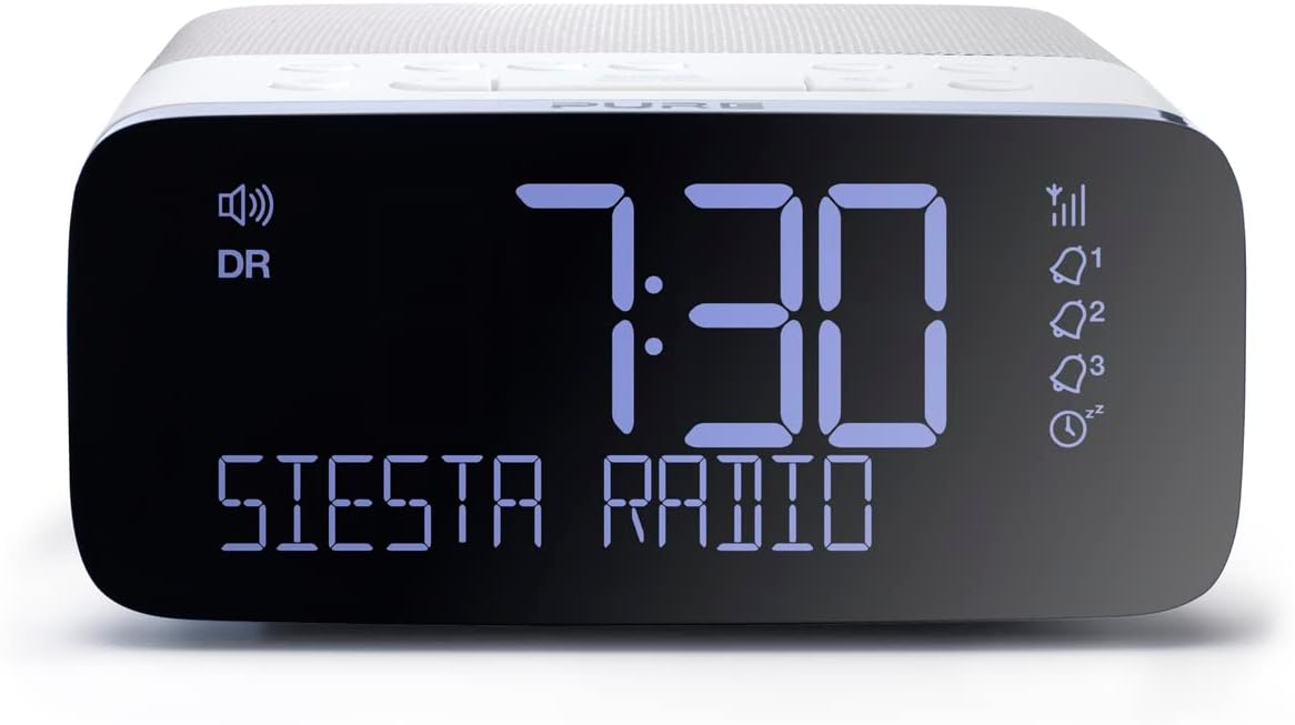Close-up of Pure Siesta Rise display showing time 7:30 and 'SIESTA RADIO' with blue backlight.