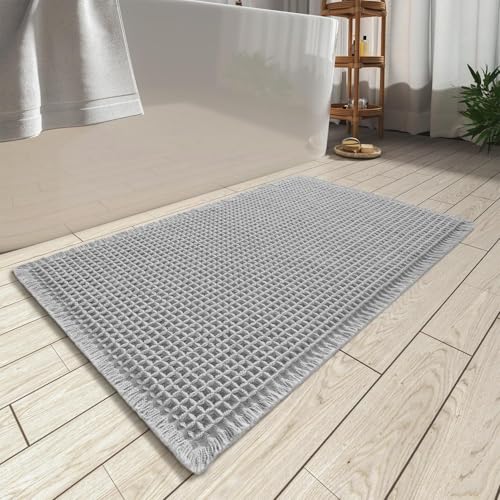 AMOAMI Upgraded Waffle Bath Mat, Super Absorbent Non Slip Bath Mats for Bathroom Floor, Washable Bathroom Rugs with Tassels, Rubber Backed Bathroom Mats, Ultra Soft, 20" x 32", Light Grey by AMOAMI - Used condition - US$20.98