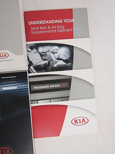 Booklet titled 'Understanding Your Seat Belt & Air Bag Supplemental Restraint System'.