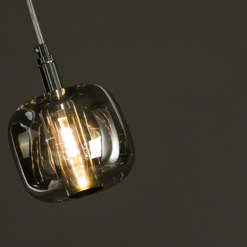 Angled close-up of the pendant light, showing the crystal and brass components, useful for illustrating cleaning points.