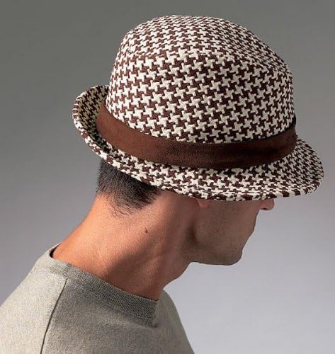 Model wearing Hat Style D, a brown and white houndstooth patterned hat with a brown band