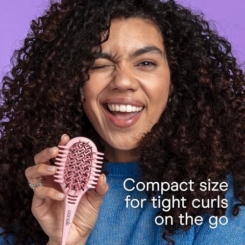 Image of Conair Curl Define Pro Mini Detangling Brush, Tight Curly Hair, Pink | For wet or damp hair and tight curls, built-in sectioning handle, reduces frizz and breakage, travel-friendly, compact size