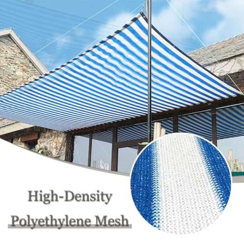 Toldo con ojales y tela azul y blanca que soluciona la falta de sombra en el jardín 5