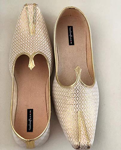 white and gold flats