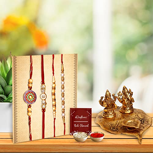 Image of eCraftIndia Designer Peacock Rakhi, Lord Krishna Idol Playing Flute Under Tree with Cow and Calf Showpiece, Roli Chawal Pack, Raksha Bandhan Greeting Card