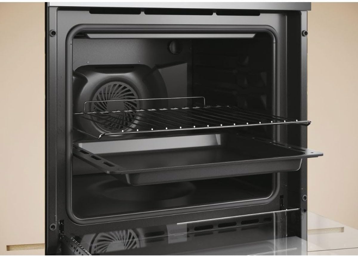 Interior of Candy FCTS896XWIFI oven showing two wire racks and a baking tray