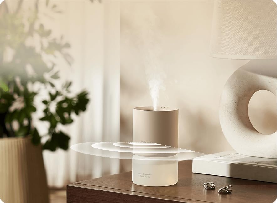 Xiaomi Smart Scent Diffuser in use, showing mist and motion sensing waves