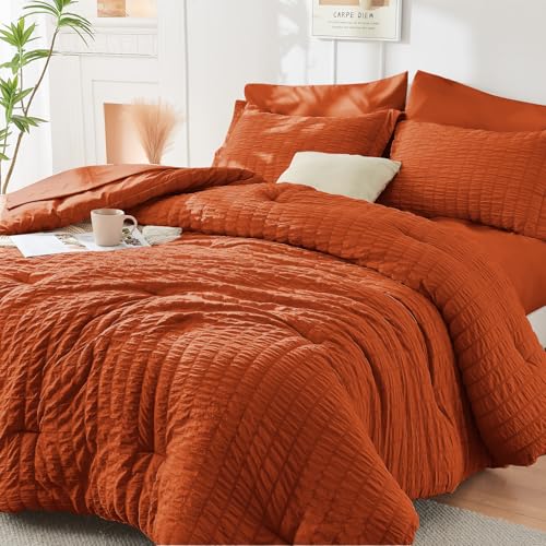 Image of HYMOKEGE Burnt Orange Oversized Queen Comforter Set Seersucker 7 Pieces, All Season Luxury Bed in a Bag for Bedroom, Bedding Set with Comforter, Sheets, Pillowcases & Shams