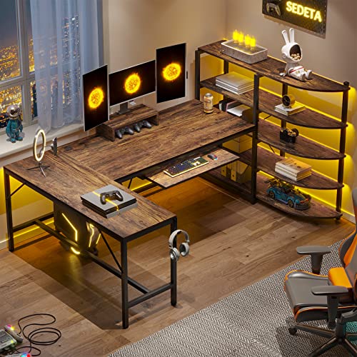 SEDETA L Shaped Gaming Desk, 63'' Reversible Computer Desk with Power Outlet and Storage Shelves, Corner Gaming Desk with LED Lights, Bookshelf for Home Office, Black