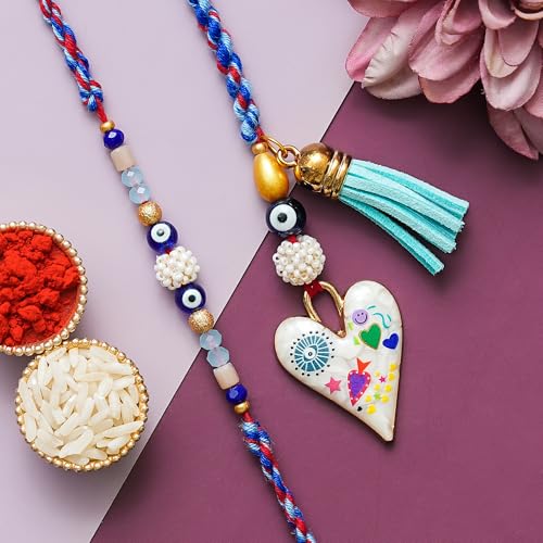 Image of Rakhi for brother and bhabhi Set of 1 Lumba Rakhi, 1 Fridge Magnet With Roli Chawal Set and Greeting Card