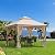 Outsunny 10' x 10' Patio Gazebo, Double Roof Outdoor Gazebo Canopy Shelter with Netting, Steel Corner Frame for Garden, Lawn, Backyard and Deck, Beige