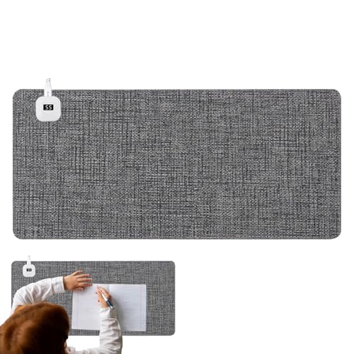 Tapis de souris chauffant contre les mains froides sur le bureau en hiver