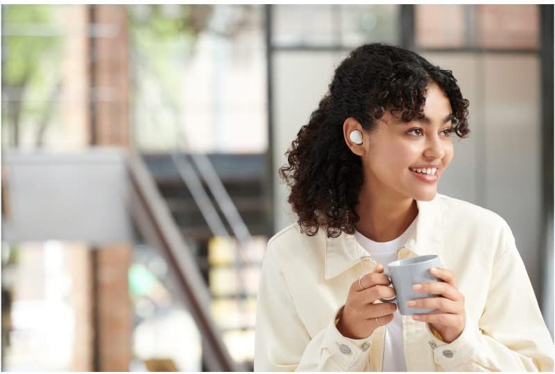 Sony WF-C500 earbuds inside their open charging case, showing indicator lights.
