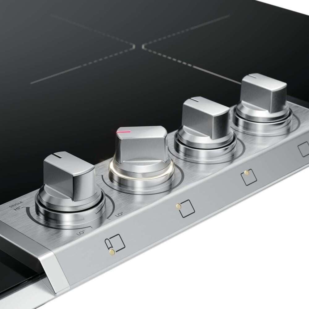 Close-up view of the Frigidaire Professional cooktop control knobs