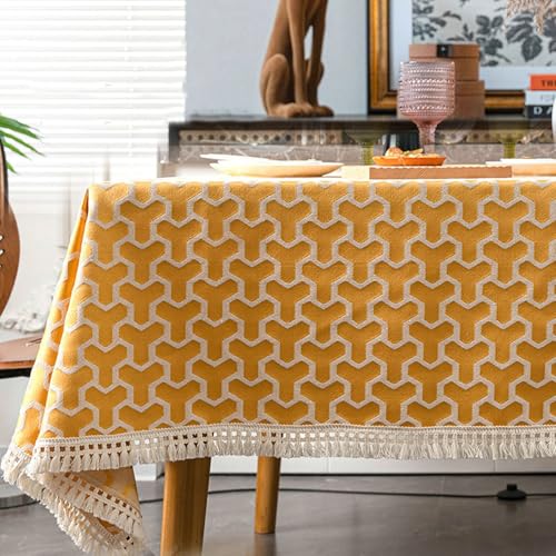 Nappe 140 x 220 rectangle en polyester antitache à motifs géométriques et pompons
