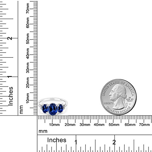 Gem Stone King 10K White Gold Oval Blue Created Sapphire and Diamond Accent 3-Stone Engagement Ring For Women | 2.65 Cttw | Gemstone Birthstone | Available In Size 5-9.54