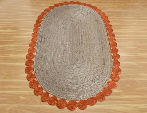 Tapis ovale en jute orange pour l'ambiance chaleureuse d'une maison de lac