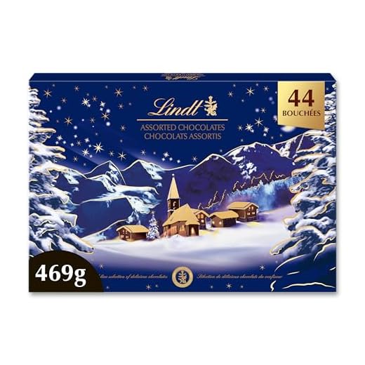 Lindt - Boîte PAYSAGE DE NOËL Assorti - Assortiment de Chocolats au Lait, Noirs et Blancs - Idéal pour Noël, 469g