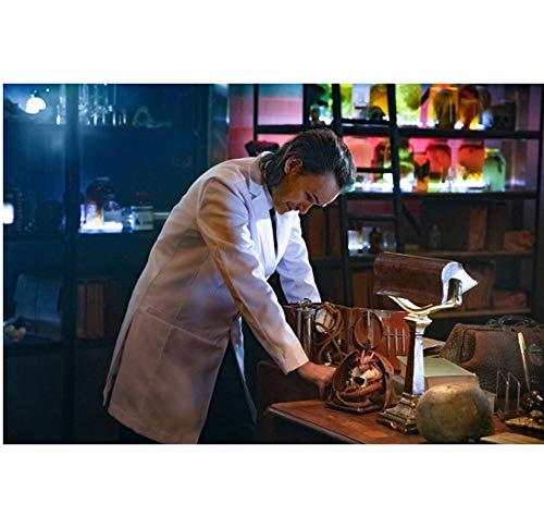 Arrow Stephen Amell as Oliver Queen standing over desk in old lab 8 x 10 Inch Photo