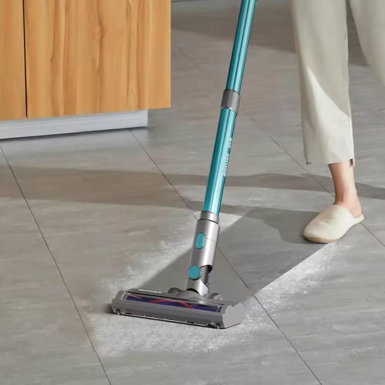 Cordless vacuum cleaner cleaning a tiled floor