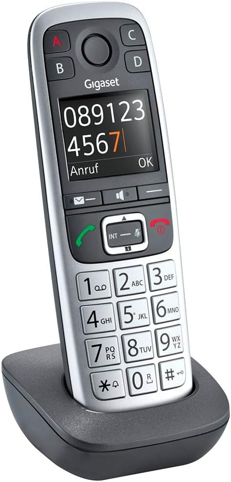 Gigaset E560HX handset in its charging cradle, displaying a dialed number.