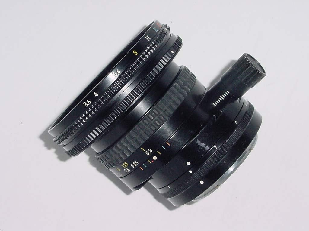Side view of the Nikon 28mm f/3.5 PC-Nikkor lens, showing the aperture and focus rings with distance markings in meters and feet, and f-stop values.