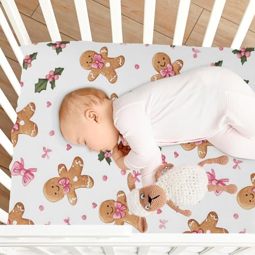 Image of Caikeny Fitted Crib Sheet for Boys Girls Gingerbread Man Pattern with Pink Bows and Holly Leaves Baby Crib Sheets Bassinet Sheets Crib Mattress Bed Sheets for Toddler Newborn Infant 52 X 28 in