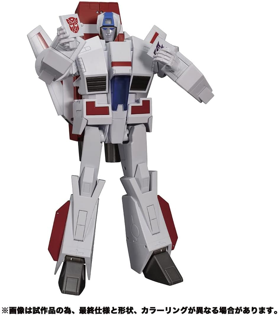 Transformers Masterpiece MP-57 Skyfire in robot mode, standing upright and holding two small cards.
