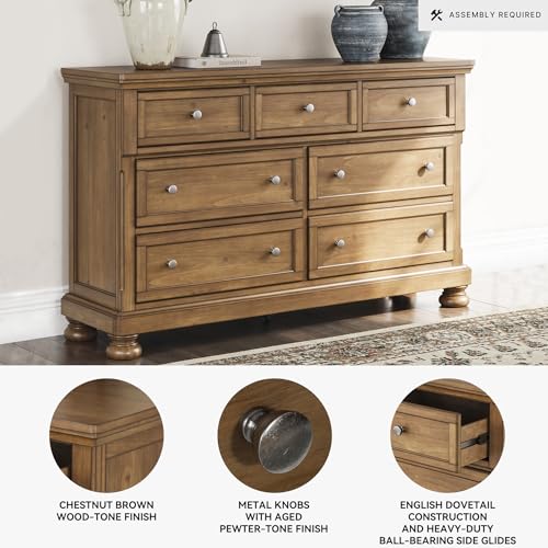 Image of Signature Design by Ashley Glarrison Dresser for Bedroom, 7 Drawer Dresser with Hidden Jewelry Tray, Poplar Solids Pine Veneer and MDF Substrate, Classic Master Suite Storage, Medium Brown