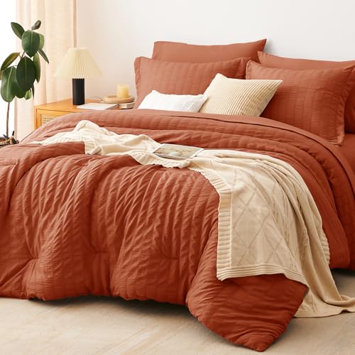 Image of CozyLux Oversized King Comforter Set with Sheets, 7 Pieces 120 inchx98 inch Burnt Orange Seersucker Bed in a Bag, Terracotta Soft Bedding Sets with Down Alternative Comforter, Sheets, Pillowcases & Shams
