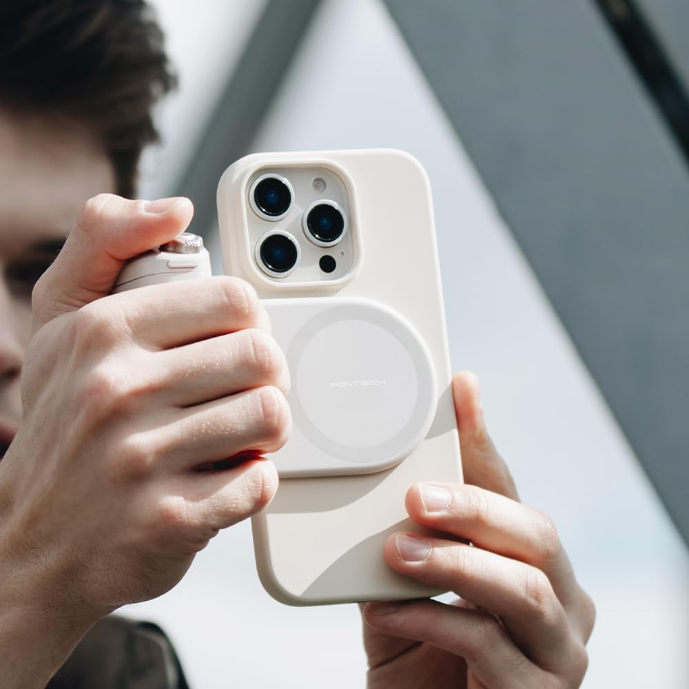 User holding phone with MagCam Grip