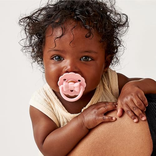 Image of Itzy Ritzy Natural Rubber Pacifiers - Baby Pacifiers with Cherry-Shaped Nipple & Large Air Holes for Added Safety - Set of 2 Binkies in Light & Dark Pink Bows (Ages 0 - 6 Months)