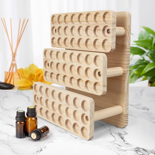 Esmalte de uñas y aceites aromáticos ordenados en una caja de madera con compartimentos 7