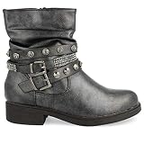 Botin moda con adornos metalicos y correas