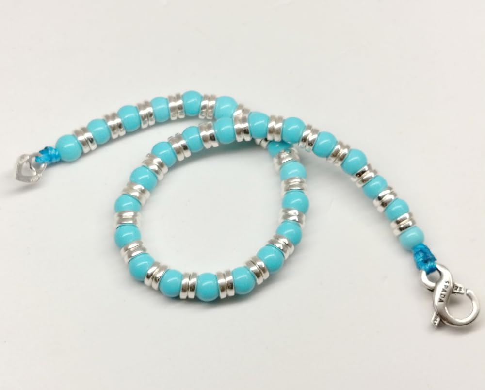 Spadarella bracciale con anellini in argento da 3 mm e pietra naturale turchese tonda da 4 mm.Prodotto artigianale.Made in Italy.Unisex.Lunghezza 19cm.